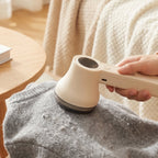 Lifestyle shot of fabric shaver in home setting