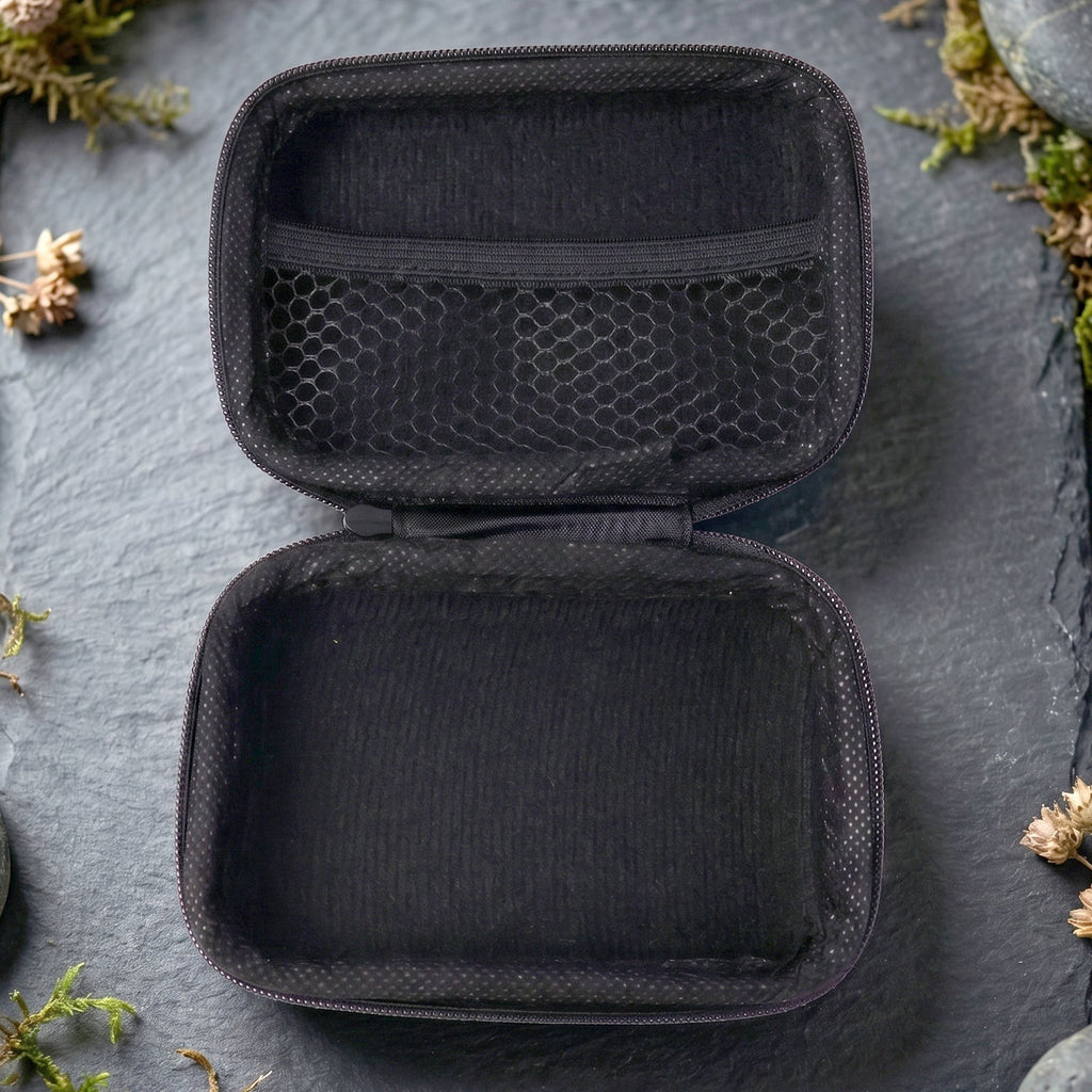 Open empty travel storage case showing interior compartments