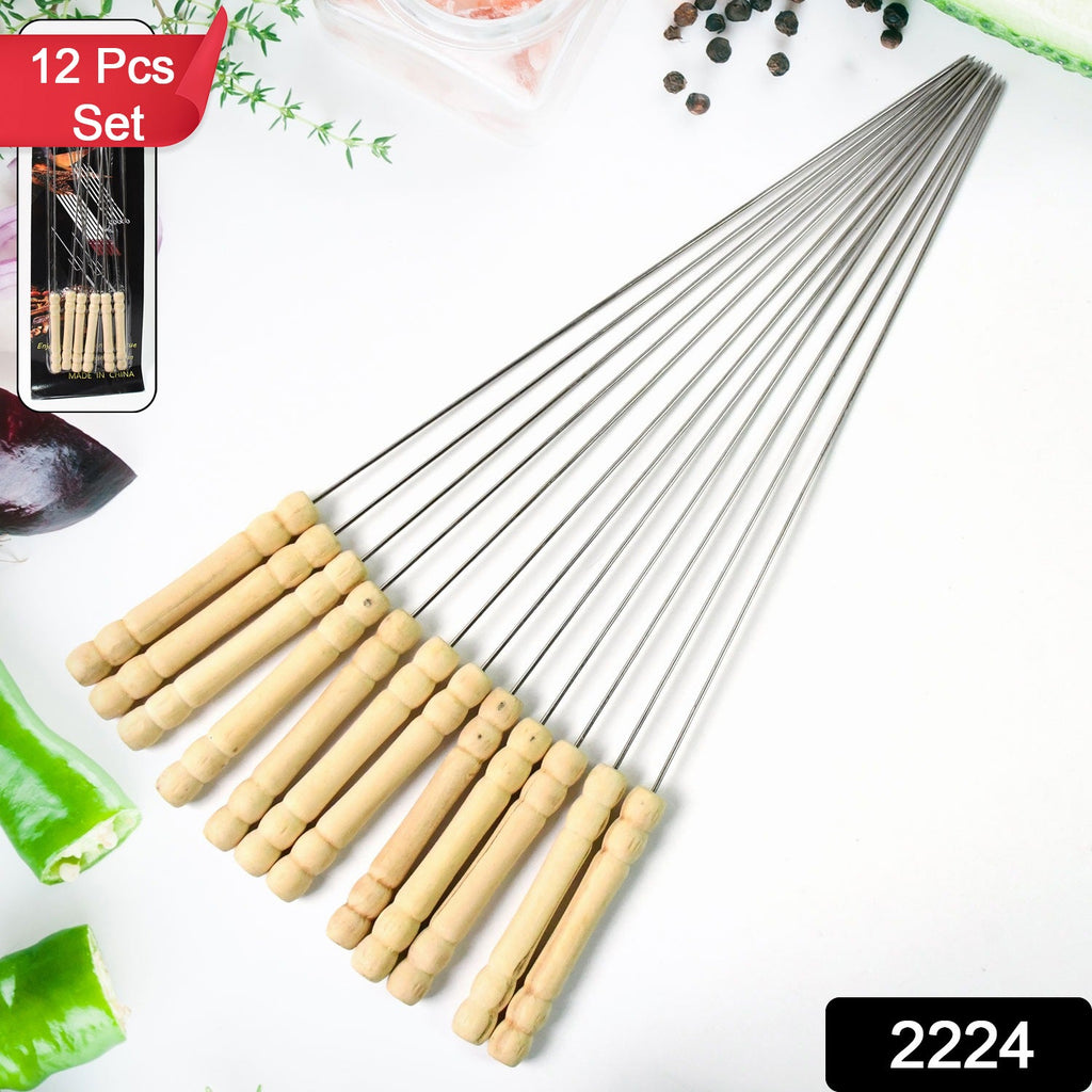 Close-up of a single stainless steel BBQ skewer with ergonomic wooden handle.