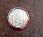 Decorative Ganesh Coin placed on a traditional pooja thali, symbolizing prosperity.