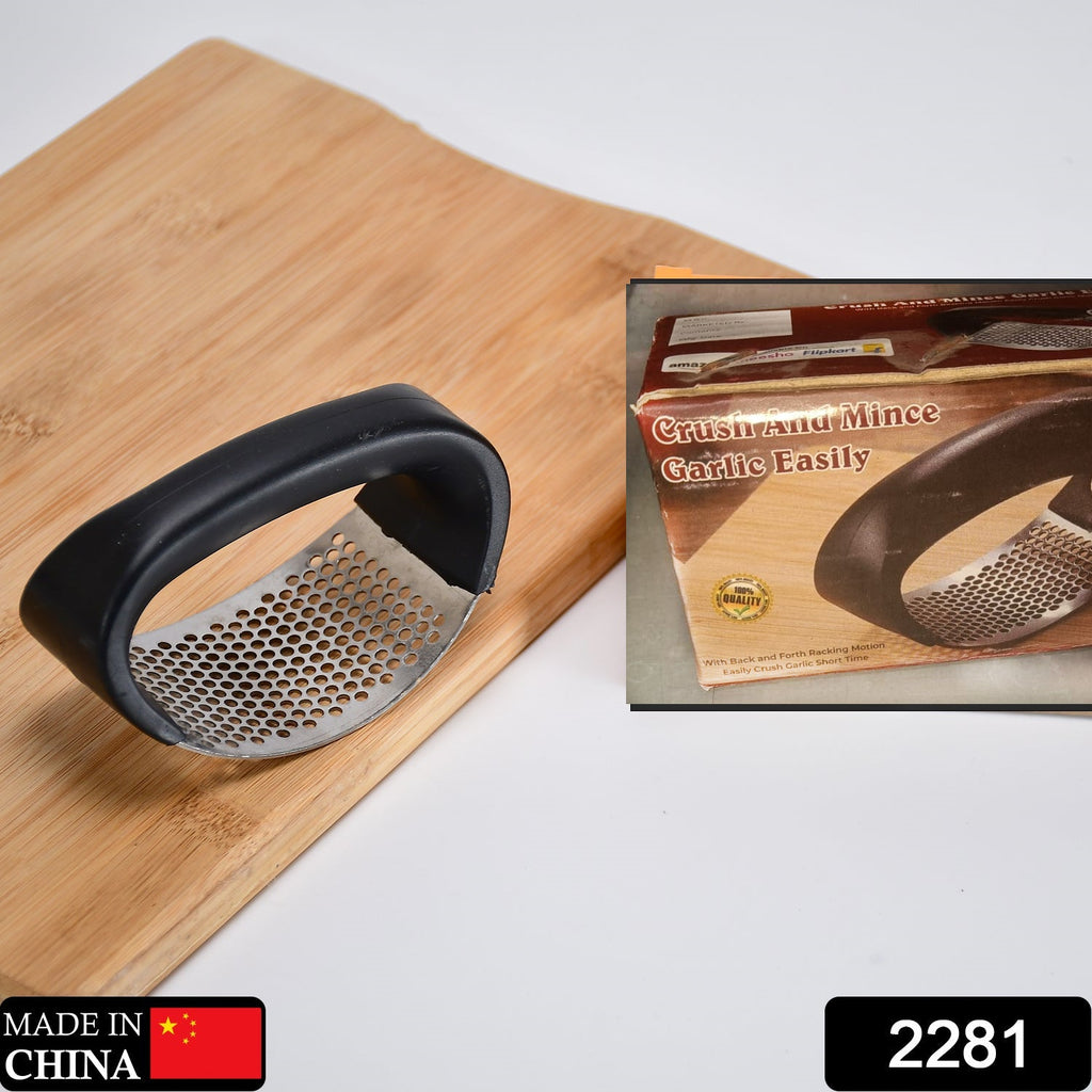 Close-up of the durable stainless steel chamber of the garlic press, ready for use.