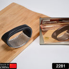 Close-up of the durable stainless steel chamber of the garlic press, ready for use.