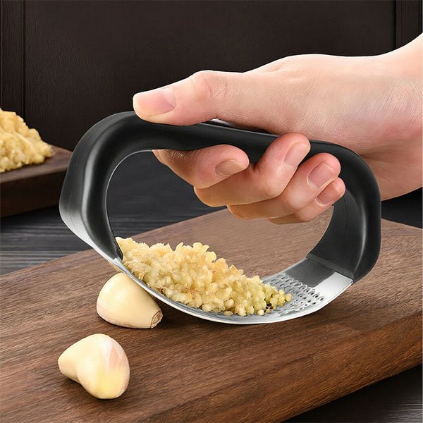 Quickslice stainless steel garlic press with ergonomic multicolor handles on a clean white background.