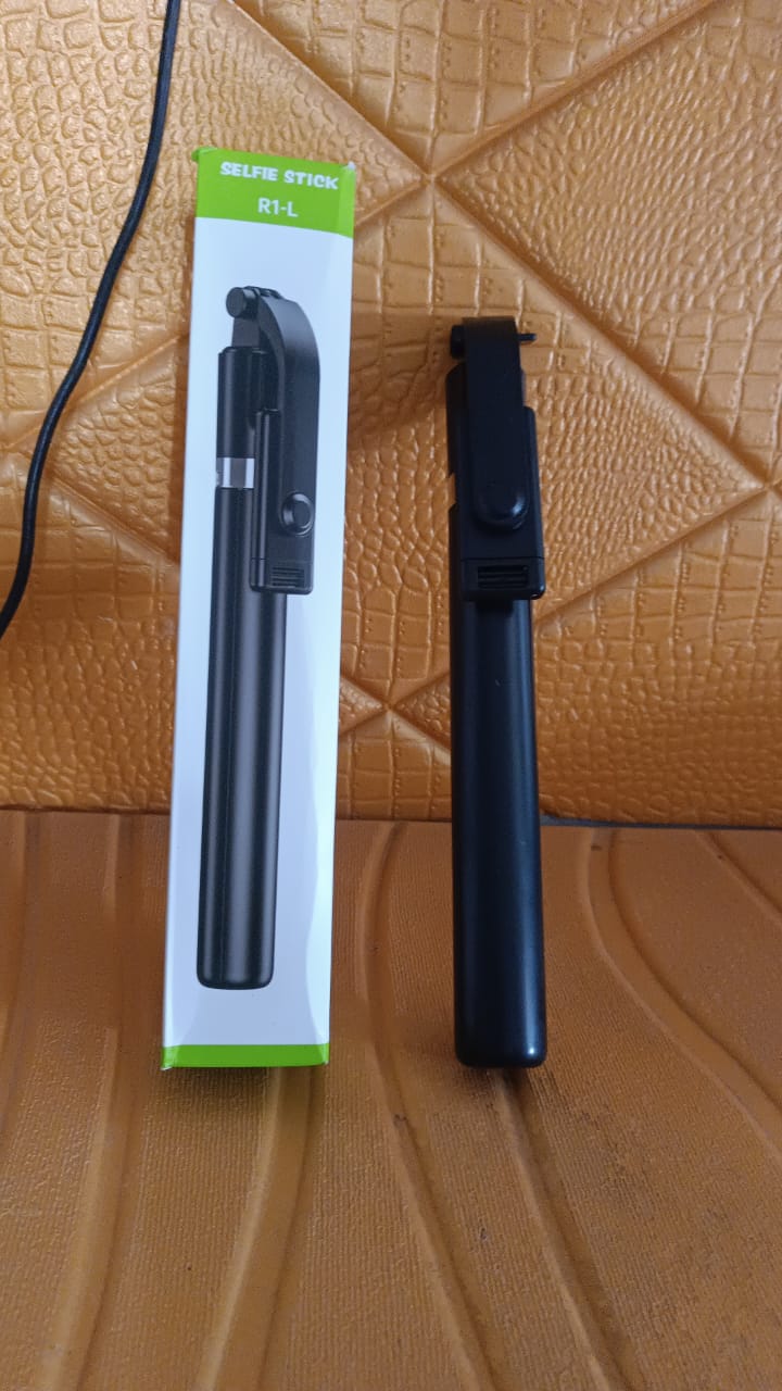 Folded selfie stick with phone holder and Bluetooth remote for travel