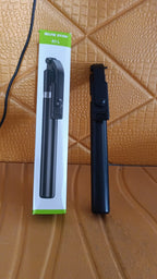 Folded selfie stick with phone holder and Bluetooth remote for travel
