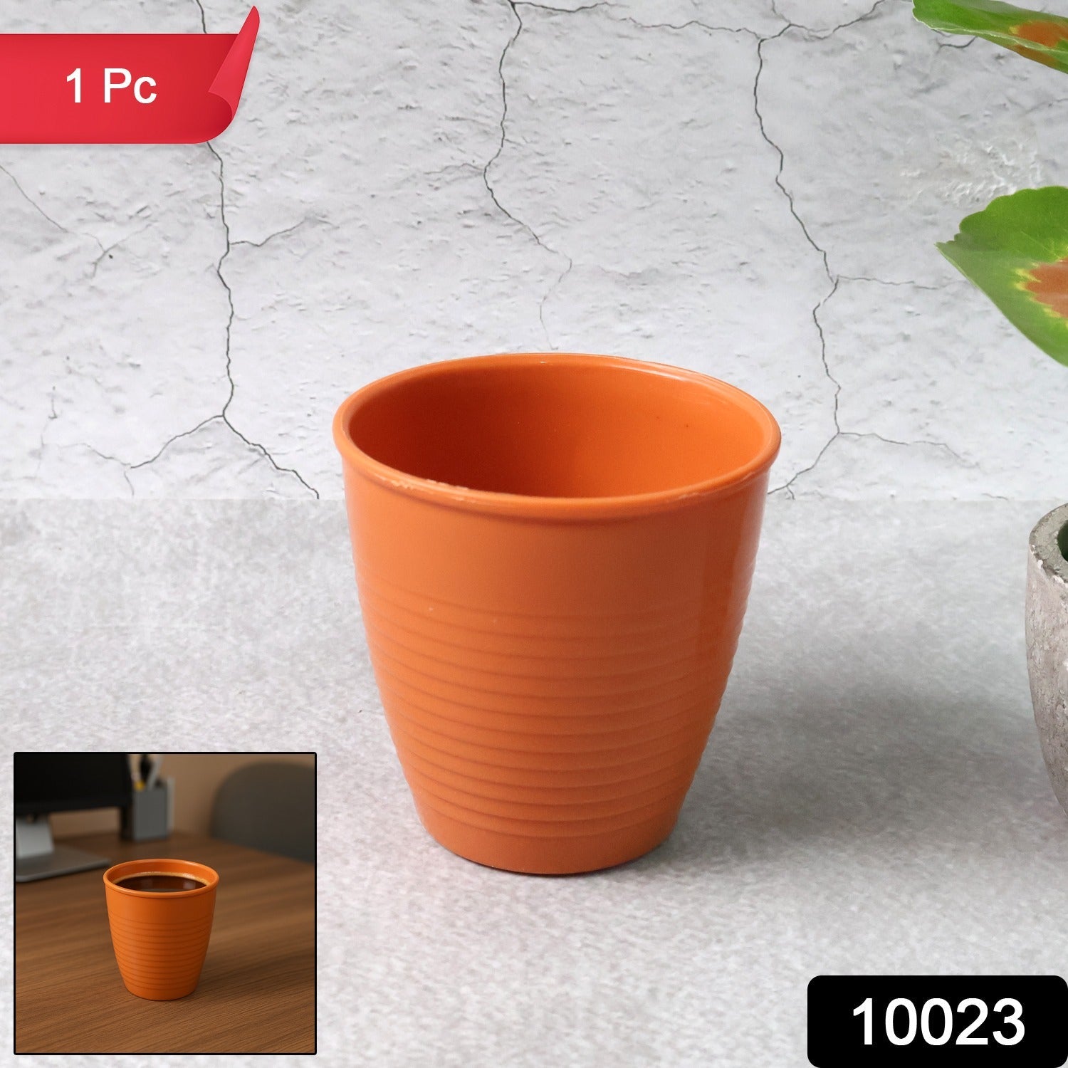 Durable plastic small drinking glass with tapered shape on white background