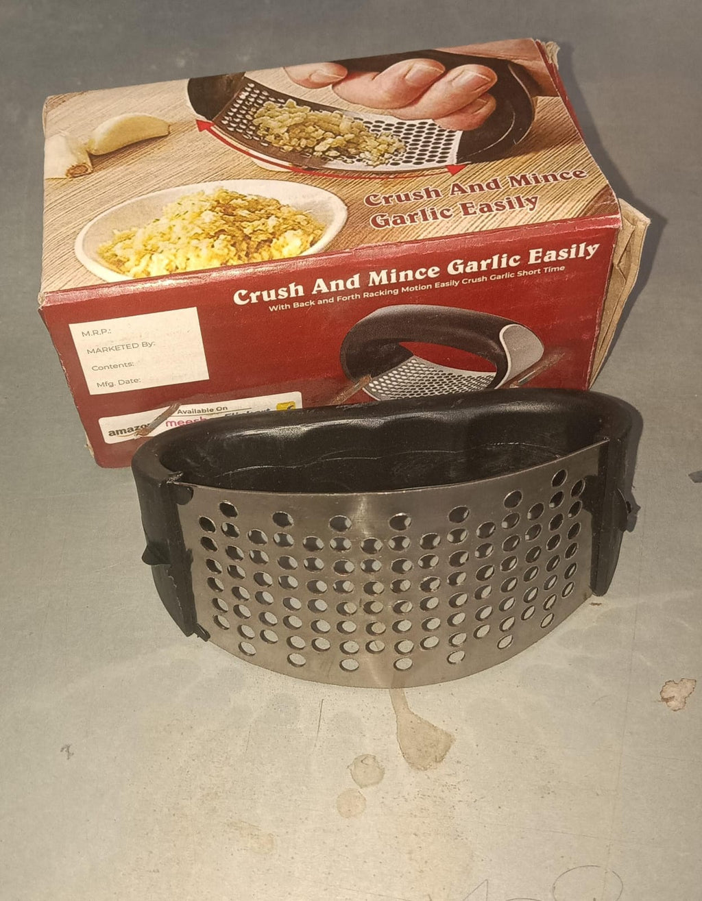 Stainless steel garlic press showing its large capacity and easy-clean design for kitchen efficiency.