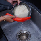Efficient strainer spoon for quick and hygienic rice washing.