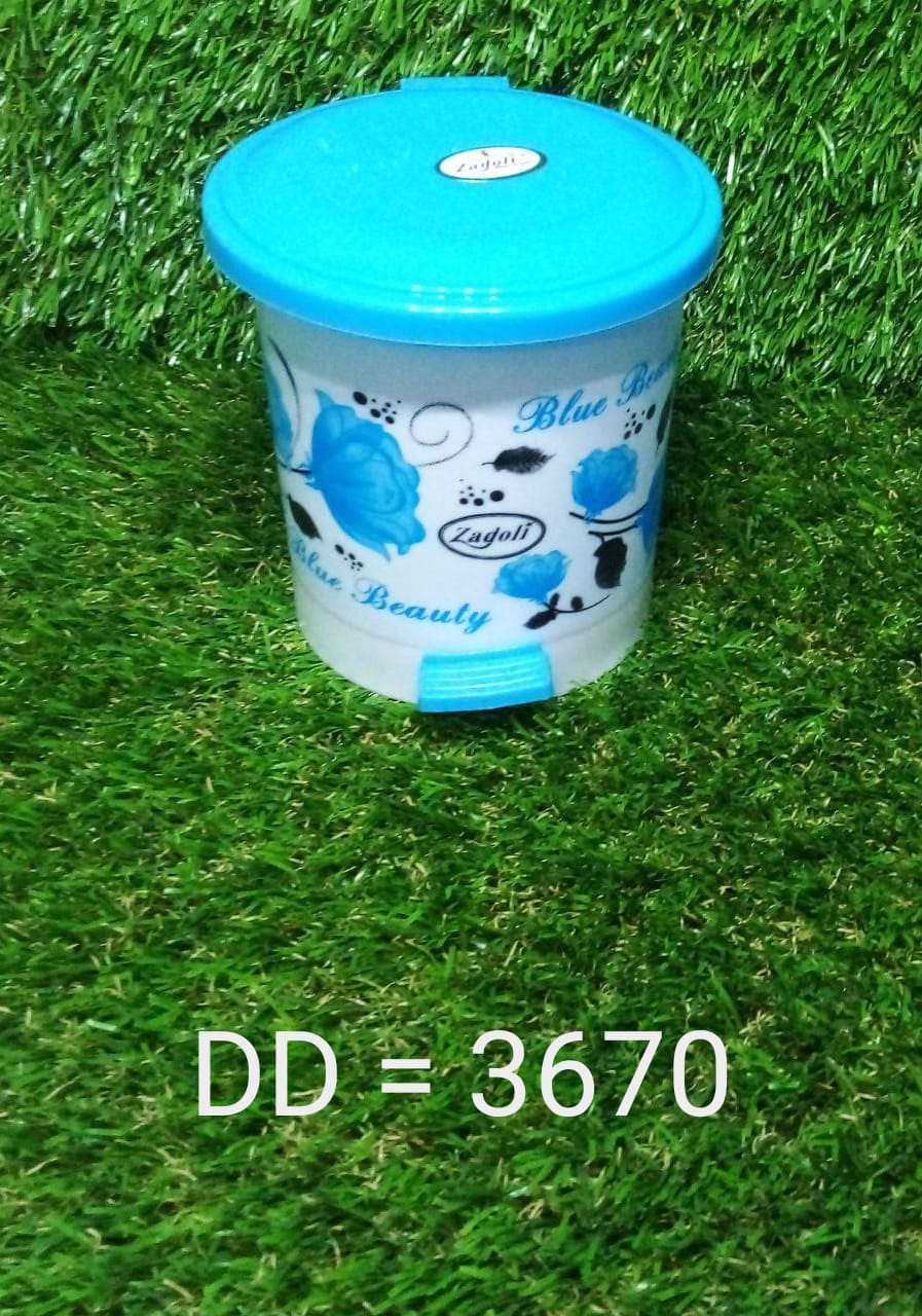 Small plastic dustbin with a foot pedal, perfect for maintaining a clean workspace.
