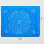 Durable silicone mat being folded to demonstrate its flexibility and ease of storage.
