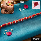 Handmade red cotton rakhi with traditional beadwork