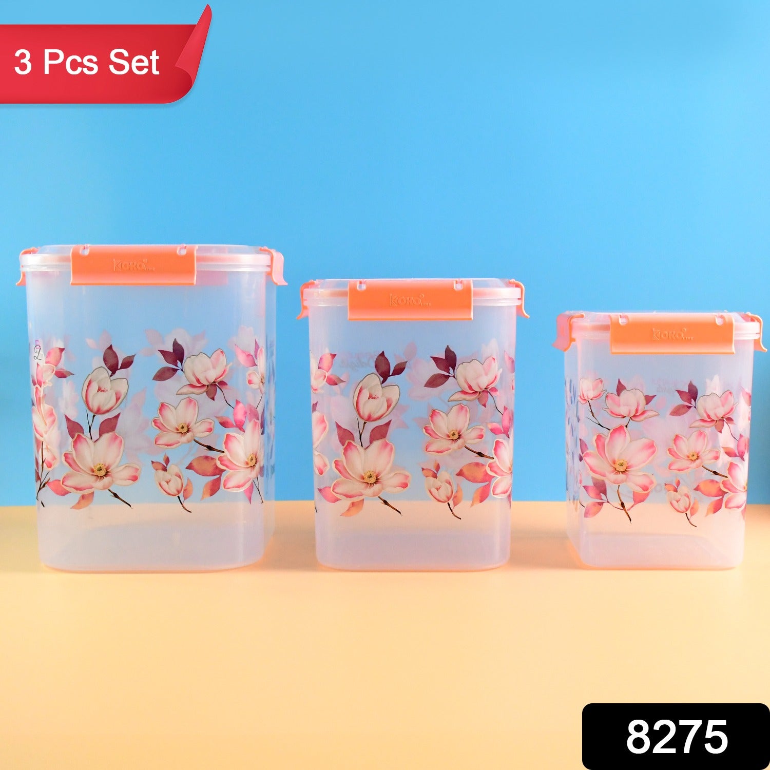 Three floral airtight food storage containers on a kitchen counter.