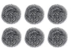 Close-up of a long-lasting round stainless steel scrubber in hand.