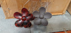 Elegant flower hair clip displayed on soft fabric background
