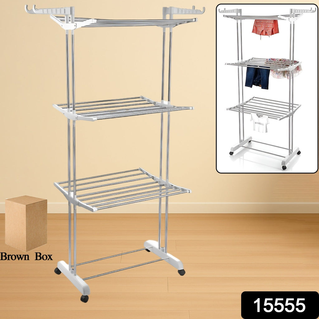 Stainless steel foldable drying rack with clothes drying on its three tiers.