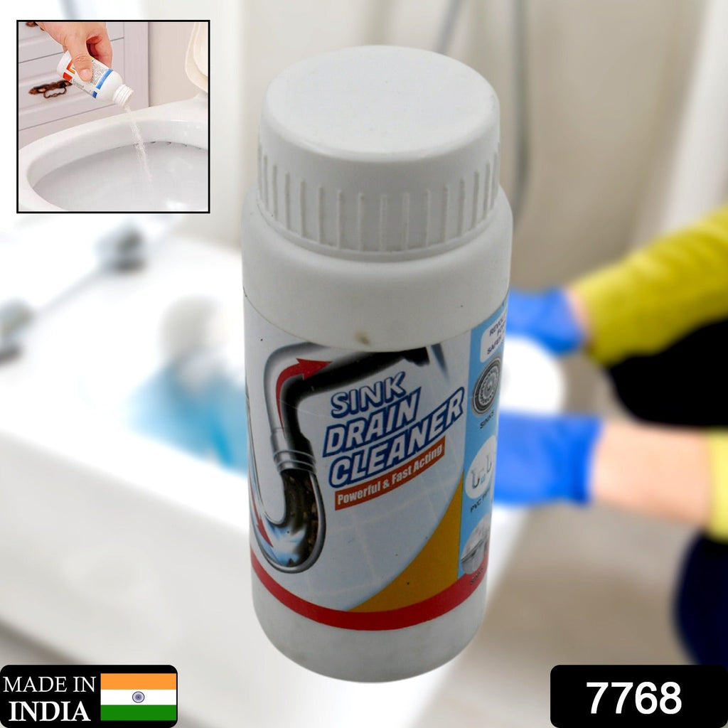 Clog remover powder being poured into a kitchen sink drain for effective cleaning.
