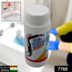 Clog remover powder being poured into a kitchen sink drain for effective cleaning.