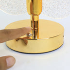 Close-up of USB powered table lamp with crystal leaf acrylic shade and golden base