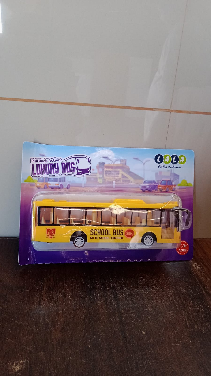 Rear view of the yellow mini bus toy showing detailed craftsmanship