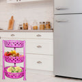 Organivo 3-tier plastic storage rack in a kitchen setting, holding fruits and vegetables.