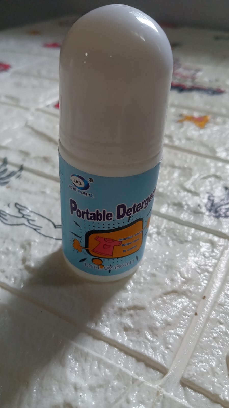 Packaging of the compact fabric stain remover for easy storage.