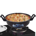 Traditional iron tava pan used for tempering spices