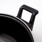 Close-up view of cast iron kadai surface highlighting seasoning