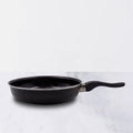 14-inch hard anodized tadka fry pan with induction base on a white surface.