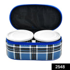 Three round stainless steel tiffin containers neatly stacked.