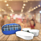 Stainless steel lunch containers ready for packing office meals.