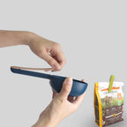 Waggy Tales pet food scoop demonstrating its practical handle clip function.