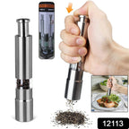 Hand operating a sleek thumb press grinder for fresh pepper.