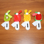 Child using mini hand pressure fruit-shaped fan to stay cool outdoors