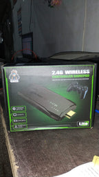 Complete package of the Spark Tots Wireless Gaming Console with controllers and accessories.