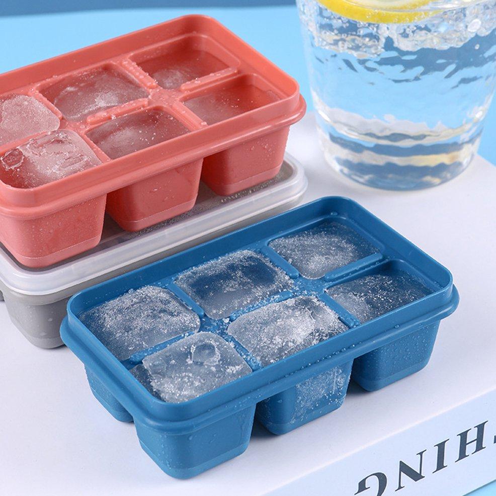 Flexible blue silicone ice tray with 6 grids, filled with water for freezing.