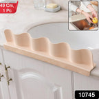 Anti-splash kitchen sink guard protecting countertop from water spill