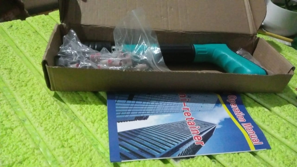 BoltForce manual steel nail gun kit showing the tool, extra nails, and accessories.