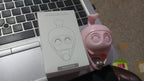 Easy-to-install no-drill wall hook with a cute cat design on a smooth surface.
