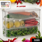 Stackable fridge storage containers holding fresh vegetables and fruits inside a refrigerator.