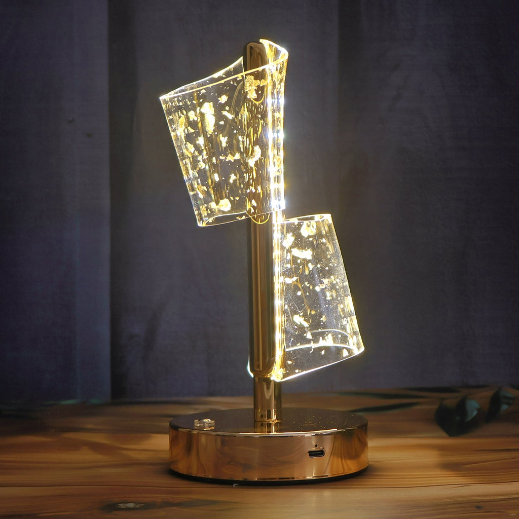Modern decorative table lamp with golden base and warm LED light