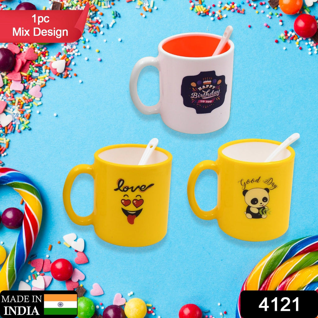 Vibrant ceramic designer coffee mug with matching spoon.