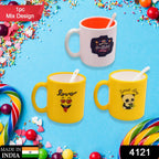 Vibrant ceramic designer coffee mug with matching spoon.