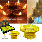 Close-up of a golden water sensor LED diya flickering with a warm light.