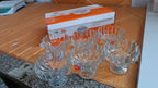 Decorated glass dessert cups, perfect for festive occasions and entertaining guests.