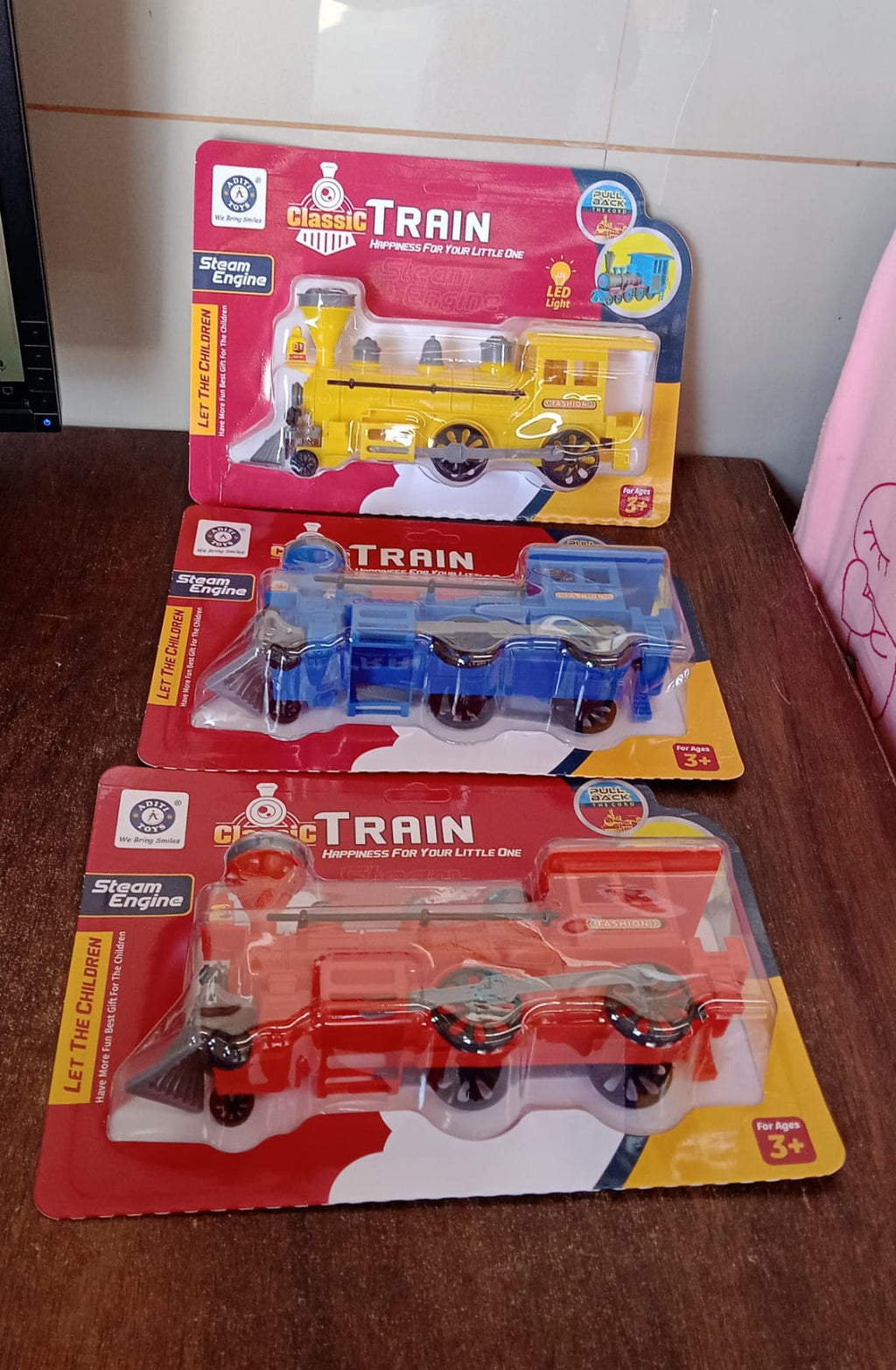 The Pull Back Train Toy displayed on a vibrant, imaginative play track.