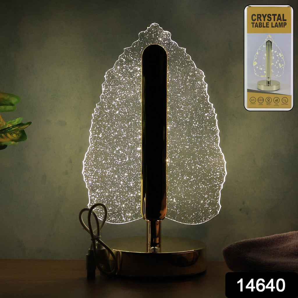 Elegant LED crystal leaf table lamp with USB power and metallic base on a desk