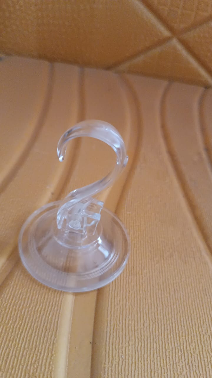 Close-up clear suction cup hook showing strong adhesion mechanism