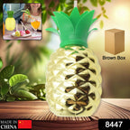 Side profile of a vibrant yellow pineapple cup, showcasing its textured design.