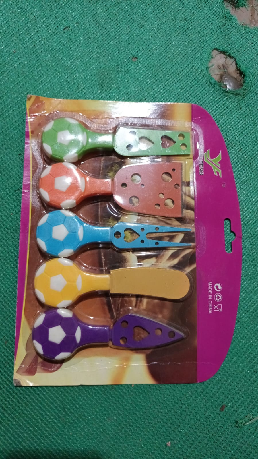 Back view of the vibrant 5-piece cheese knife set packaging.