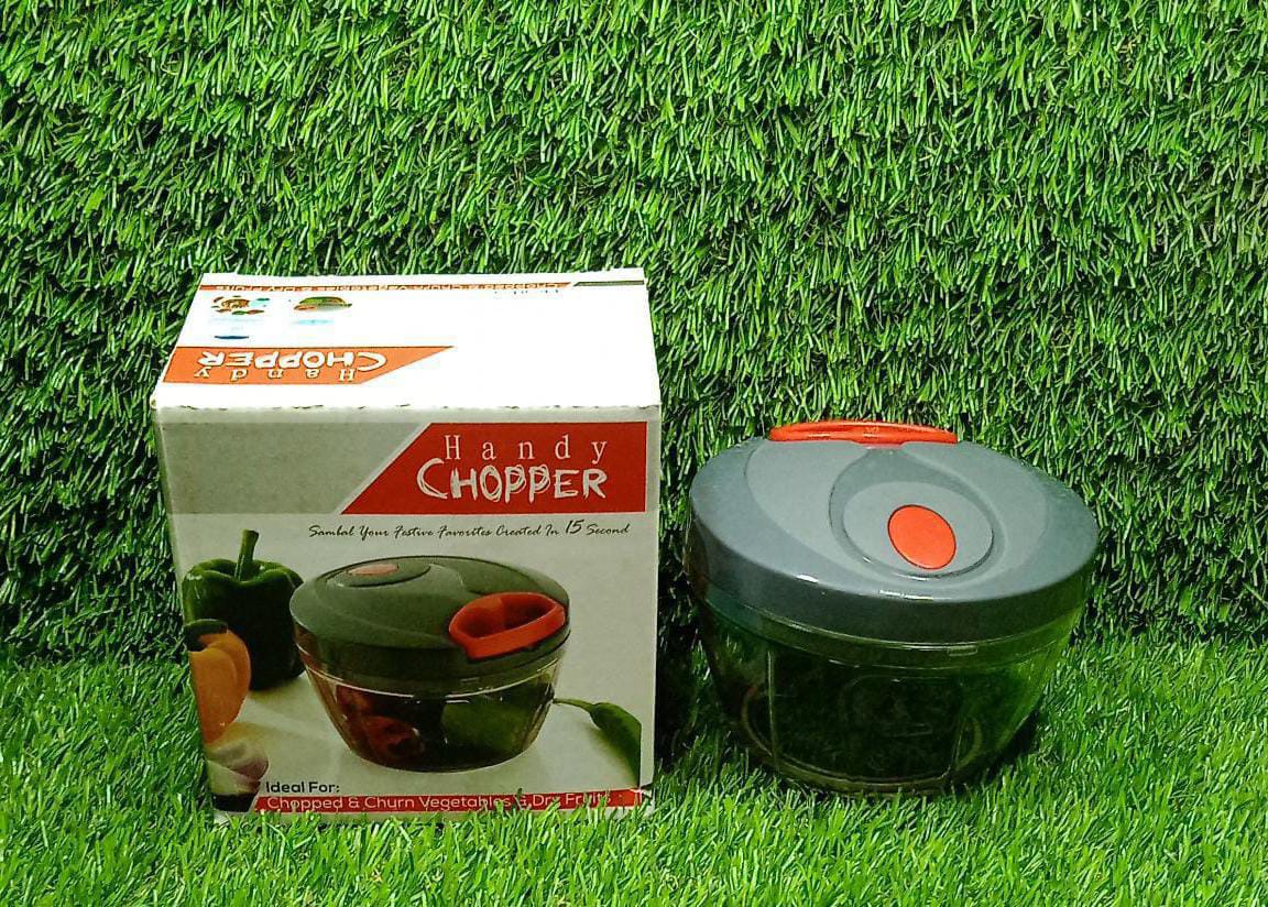 Lifestyle shot of the manual food chopper being used to prepare ingredients for a meal.
